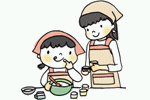 料理する親子の画像